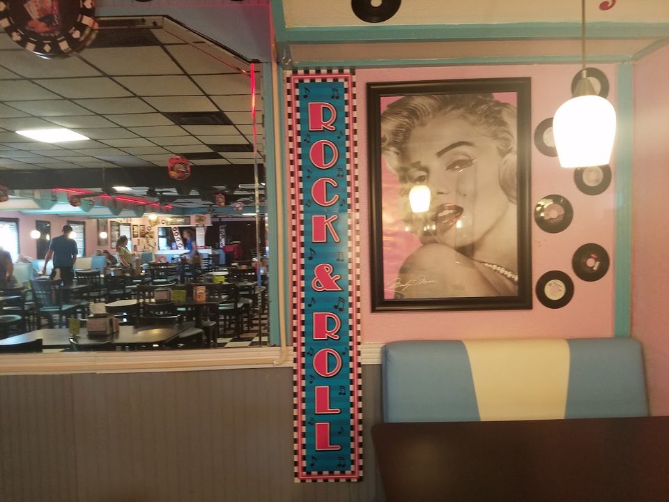 Classic diner booths and framed wall decor.